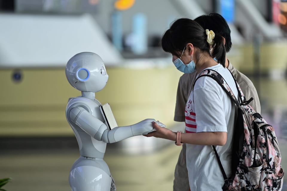 Robots roam airports reminding passengers to put their masks on.