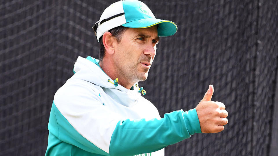 Pictured here, Australia coach Justin Langer gives a thumbs up during a training session.