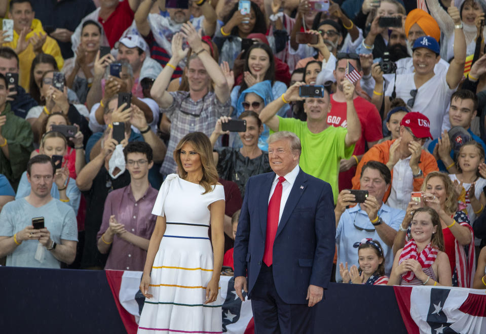 WASHINGTON, DC - JULY 04: President Donald Trump and first lady Melania Trump take the stage on July 04, 2019 in Washington, DC. President Trump is holding a "Salute to America" celebration on the National Mall on Independence Day this year with musical performances, a military flyover, and fireworks. (Photo by Tasos Katopodis/Getty Images)