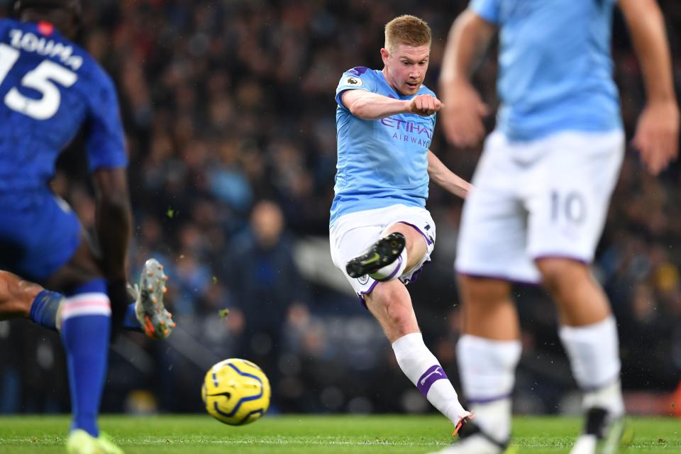 Manchester City's Belgian midfielder Kevin De Bruyne shoots to score their first goal during the English Premier League football match between Manchester City and Chelsea at the Etihad Stadium in Manchester, north west England, on November 23, 2019. (Photo by Paul ELLIS / AFP) / RESTRICTED TO EDITORIAL USE. No use with unauthorized audio, video, data, fixture lists, club/league logos or 'live' services. Online in-match use limited to 120 images. An additional 40 images may be used in extra time. No video emulation. Social media in-match use limited to 120 images. An additional 40 images may be used in extra time. No use in betting publications, games or single club/league/player publications. /  (Photo by PAUL ELLIS/AFP via Getty Images)