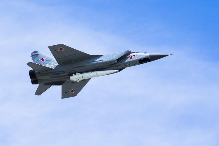 FILE - a Russian Air Force MiG-31K jet carries a high-precision hypersonic aero-ballistic missile Kh-47M2 Kinzhal during the Victory Day military parade to celebrate 73 years since the end of WWII and the defeat of Nazi Germany, in Moscow, Russia on Wednesday, May 9, 2018.The latest Russian missile barrage against Ukraine’s civilian infrastructure on Thursday, March 9, 2023 has marked one of the largest such attacks in months. Russia has used the Kinzhal missiles from the early days of the hostilities. (AP Photo, File)