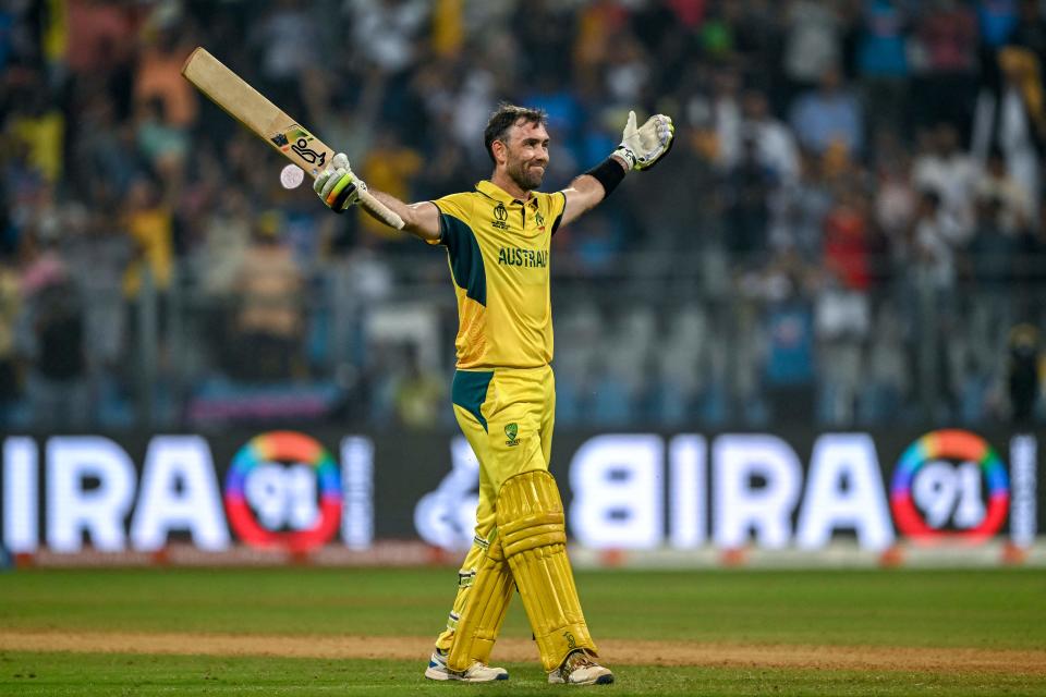 TOPSHOT - Australia's Glenn Maxwell celebrates after winning the 2023 ICC Men's Cricket World Cup one-day international (ODI) match between Australia and Afghanistan at the Wankhede Stadium in Mumbai on November 7, 2023. (Photo by INDRANIL MUKHERJEE / AFP) / -- IMAGE RESTRICTED TO EDITORIAL USE - STRICTLY NO COMMERCIAL USE -- (Photo by INDRANIL MUKHERJEE/AFP via Getty Images)