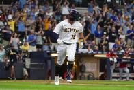 Milwaukee Brewers' Keston Hiura reacts after hitting a home run during the ninth inning of a baseball game against the Cincinnati Reds Sunday, Aug. 7, 2022, in Milwaukee. (AP Photo/Morry Gash)