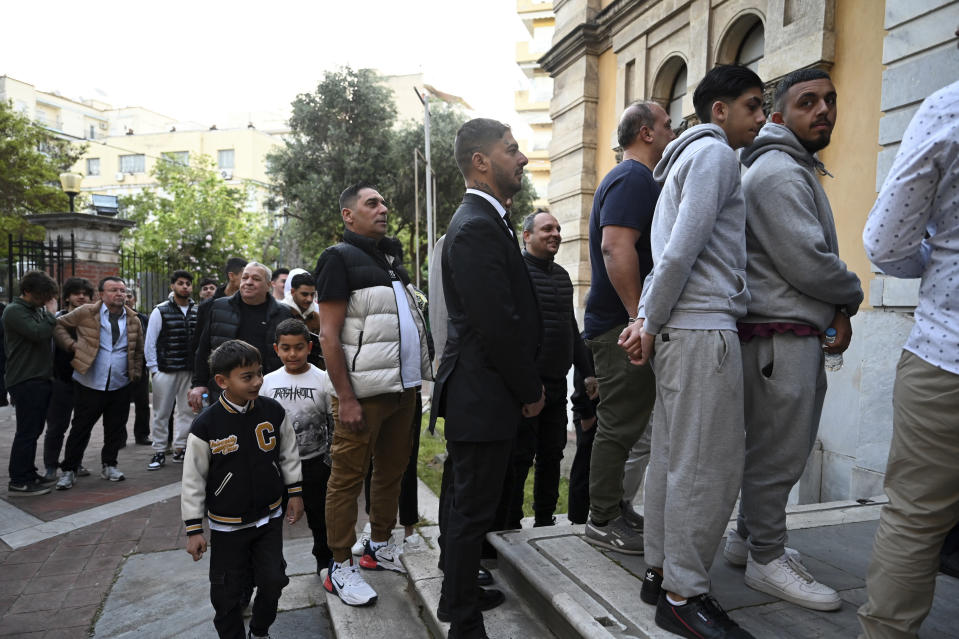 People wait to enter the historic Yeni Cami, or New Mosque, to attend the morning prayers, in the port city of Thessaloniki, northern Greece, Wednesday, April 10, 2024. Eid prayers were held in the historic former mosque in northern Greece for the first time in 100 years. (AP Photo/Giannis Papanikos)