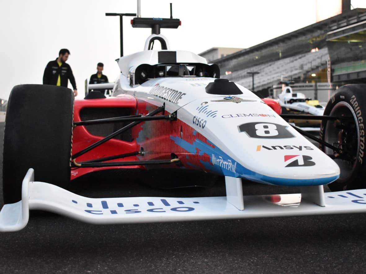 This is the autonomous race car University of Waterloo students Ben Zhang and Brian Mao helped build. All teams were given the same hardware for the cars, but had to create their own software to make them race. (Submitted by: Ben Zhang and Brian Mao/Indy Autonomous Challenge - image credit)