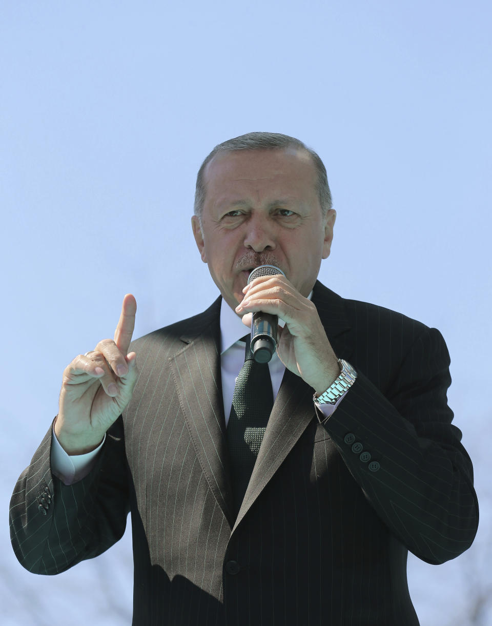 Turkey's President Recep Tayyip Erdogan addresses supporters of his ruling Justice and Development Party during a rally in Eregli, Turkey, Tuesday, March 19, 2019. Ignoring widespread criticism, Erdogan has again shown excerpts of a video taken by the attacker who killed 50 people in mosques in New Zealand at a campaign rally. (Presidential Press Service via AP, Pool)