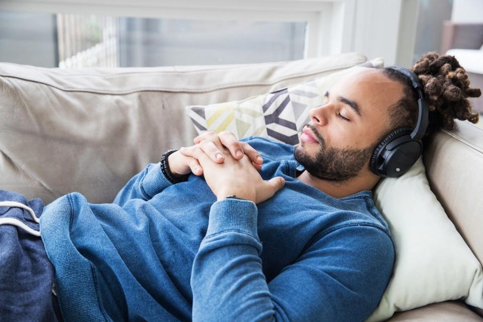 Research shows that listening to relaxing words while asleep can help slow the heart rate and prime the body for higher-quality sleep. Mat Hayward – stock.adobe.com