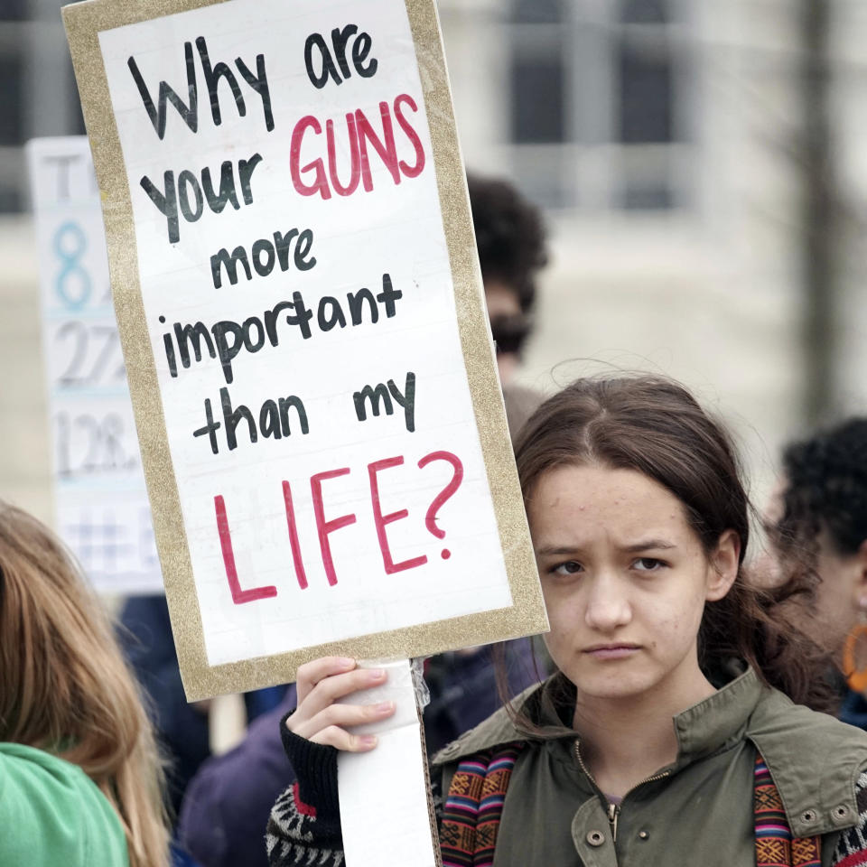 <p>Maura Palden from Bard College at Simon’s Rock protests along Main Street in Great Barrington, Mass., Friday April 20, 2018, as they take part in a national school walkout event to protest gun violence. Protests were held across the country Friday, on the 19th anniversary of the Columbine High School shooting. (Photo: Ben Garver/The Berkshire Eagle via AP) </p>