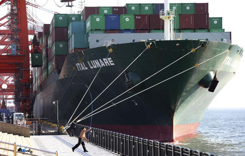 A container ship is docked at a port in Tokyo, Monday, Jan. 27, 2014. Japan's trade deficit surged to a record 11.47 trillion yen ($112 billion) in 2013 as the shutdown of nuclear power plants swelled the nation's energy import bill. Provisional data Monday showed that exports rose 9.5 percent to 69.8 trillion yen ($680.9 billion), while imports jumped 15 percent to 81.3 trillion yen ($793.2 billion). (AP Photo/Koji Sasahara)