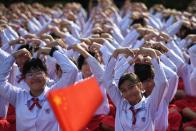 Thai students form a heart shape on Valentine's Day to show their support for China on their fight against coronavirus in a school in Ayutthaya