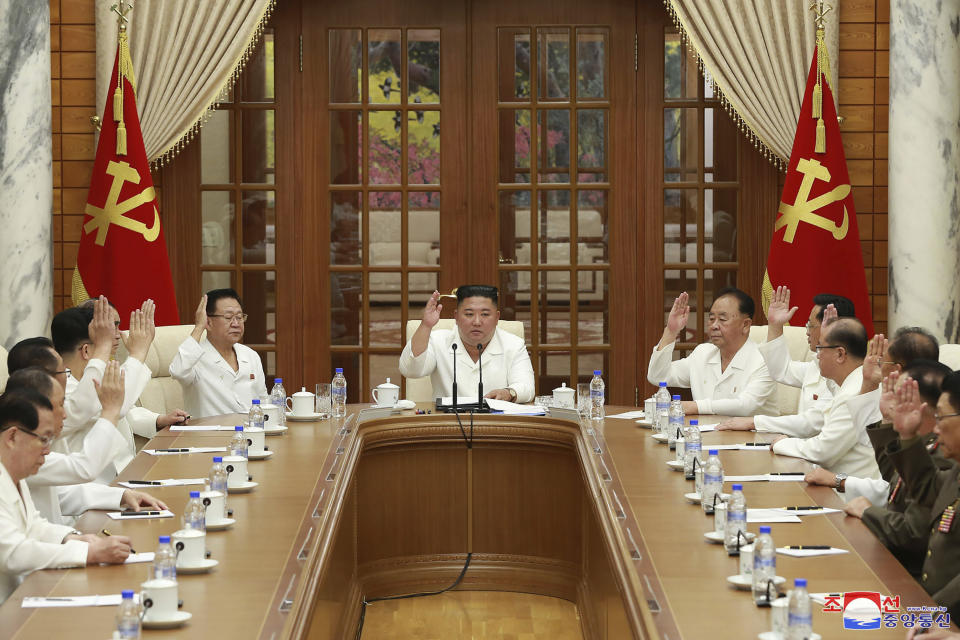 In this photo provided by the North Korean government, North Korean leader Kim Jong Un, center, attends an enlarged meeting of the Politburo of the ruling Workers’ Party in Pyongyang, North Korea, Tuesday, Aug. 25, 2020. Independent journalists were not given access to cover the event depicted in this image distributed by the North Korean government. The content of this image is as provided and cannot be independently verified. Korean language watermark on image as provided by source reads: "KCNA" which is the abbreviation for Korean Central News Agency. (Korean Central News Agency/Korea News Service via AP)