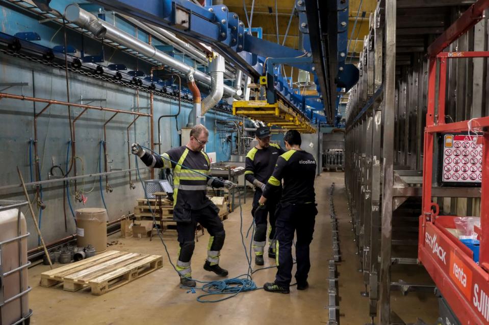 Workers at the Nammo ammunition plant install new cooling sheds for artillery shells in Karlskoga, Sweden on April 2, 2024. (Francis Farrell/The Kyiv Independent)