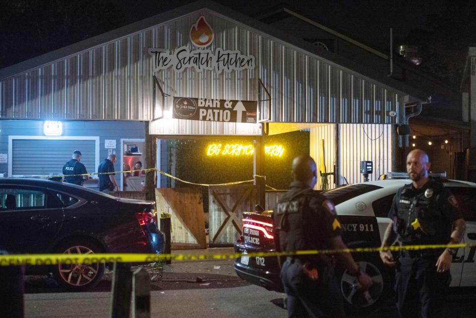Crime scene tape surrounds The Scratch Kitchen restaurant after a shooting during a Cinco de Mayo party late Friday, May 5, 2023, in Ocean Springs, Miss.