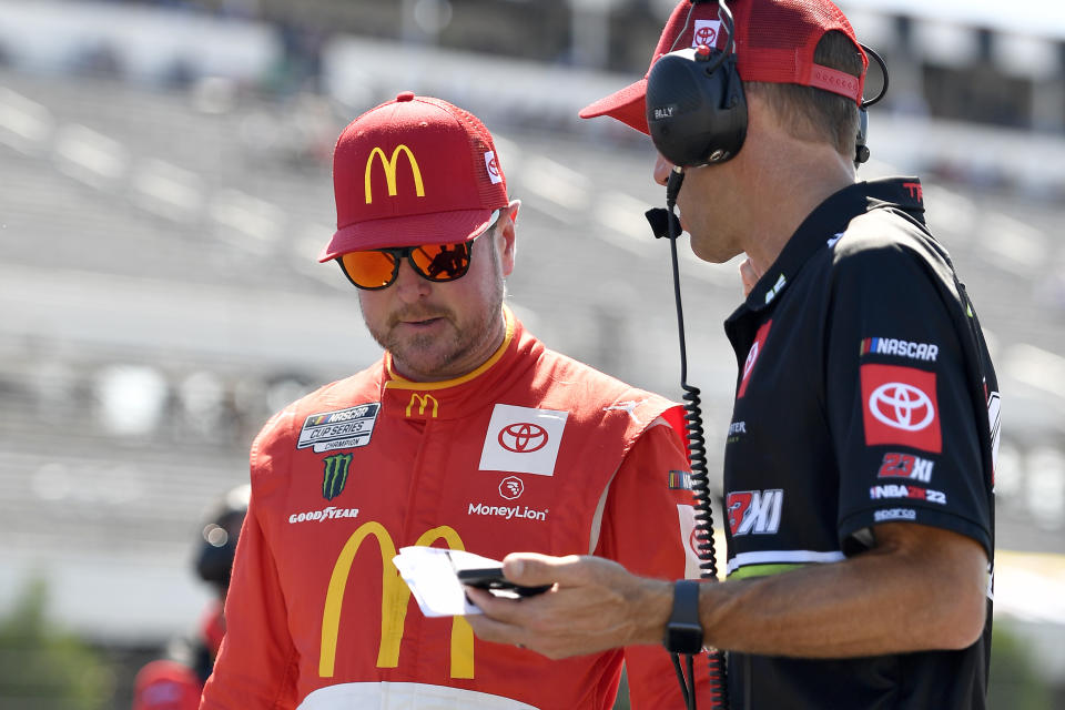 LONG POND, PENNSYLVANIA - JULY 23: Kurt Busch, driver of the #45 McDonald's Toyota, works with a crew member during qualifying for the NASCAR Cup Series M&amp;M's Fan Appreciation 400 at Pocono Raceway on July 23, 2022 in Long Pond, Pennsylvania. (Photo by Logan Riely/Getty Images)