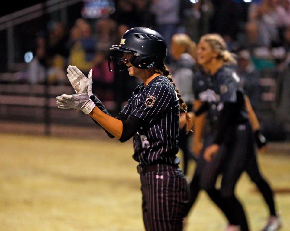 Penn junior Izabella Hanna celebrates after scoring the winning run in the bottom of the 9th, giving the Kingsmen a 5-4 win over New Prairie in NIC softball action Monday, May 13, 2024, at Penn High School in Mishawaka.