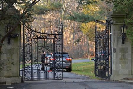 A man stands outside a vehicle inside the gates of Killenworth, an estate built in 1913 for George du Pont Pratt and purchased by the former Soviet Union in the 1950's, in Glen Cove, Long Island, New York, U.S., on December 30, 2016. REUTERS/Rashid Umar Abbasi