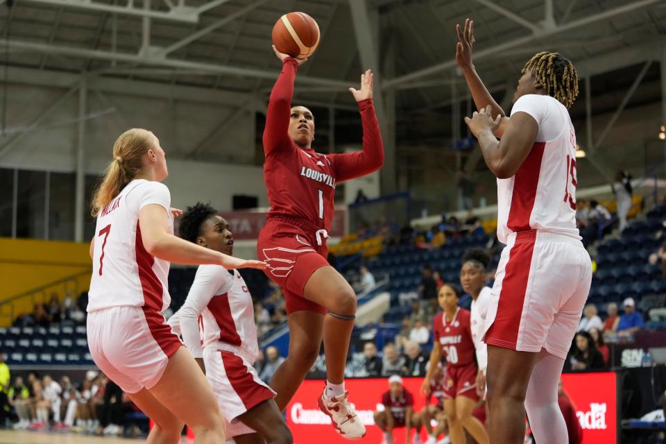 Jul 16, 2023; Toronto, Ontario, Canada; USA-University of Louisville guard Sydney Taylor (1) shoots for a basket as Canada forward Tara Wallack (7) and forward Nana Owusu-Anane (15) defend during the first half of the Women's Gold game at the at Mattamy Athletic Centre. Mandatory Credit: John E. Sokolowski-USA TODAY Sports