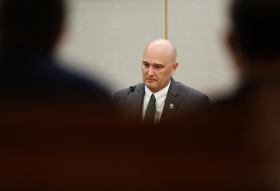 Balch Springs police officer Roy Oliver, who is charged with the murder of 15-year-old Jordan Edwards, pauses during his testimony with defense attorney Jim Lane during the sixth day of his trial at the Frank Crowley Courts Building in Dallas on Thursday, Aug. 23, 2018. (Rose Baca/The Dallas Morning News via AP)