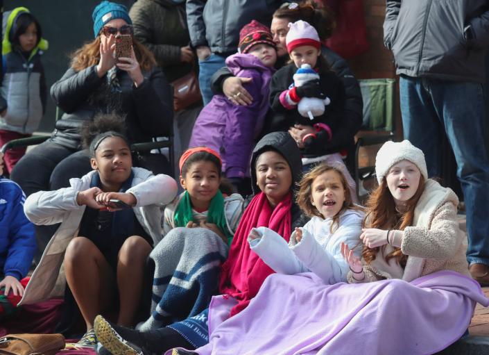Young parade-goers watch Santa during the 57th Annual Wilmington Jaycees Christmas Parade Saturday, Nov. 27, 2021.