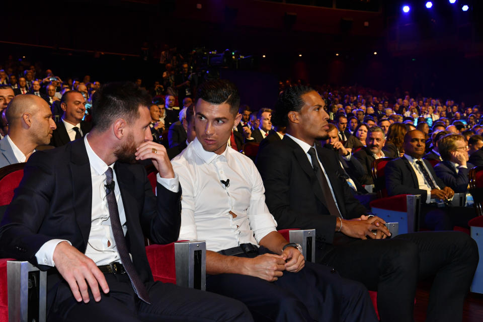 MONACO, MONACO - AUGUST 29: Cristiano Ronaldo of Juventus speaks to Lionel Messi of FC Barcelona during the UEFA Champions League Draw, part of the UEFA European Club Football Season Kick-Off 2019/2020 at Salle des Princes, Grimaldi Forum on August 29, 2019 in Monaco, Monaco. (Photo by Harold Cunningham - UEFA/UEFA via Getty Images)