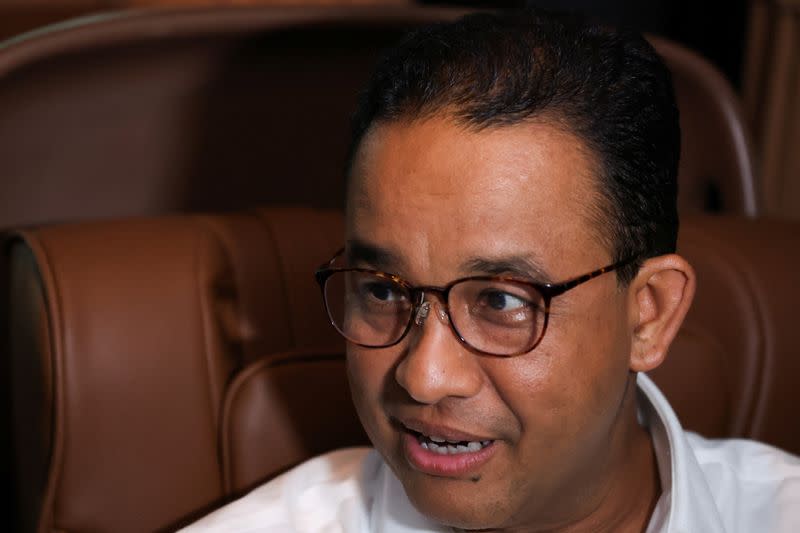 Former Jakarta Governor and presidential candidate Anies Baswedan speaks during an interview in a car in Tasikmalaya