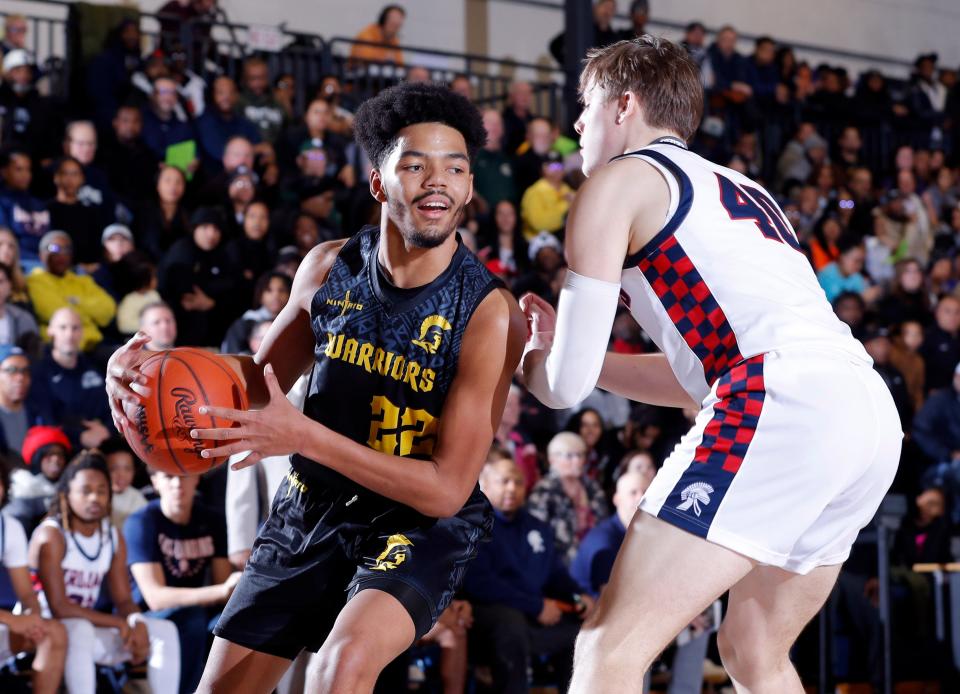 Waverly's Derek Thomas II, left, drives against East Lansing's Charlie Baker, Thursday, Jan. 11, 2024, in East Lansing.