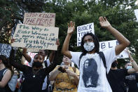 Demonstrators hold up their hands during a rally in Sacramento, Calif., Tuesday, June 2, 2020, protesting the death of George Floyd. Floyd died May 25 after being restrained by Minneapolis police. (AP Photo/Rich Pedroncelli)