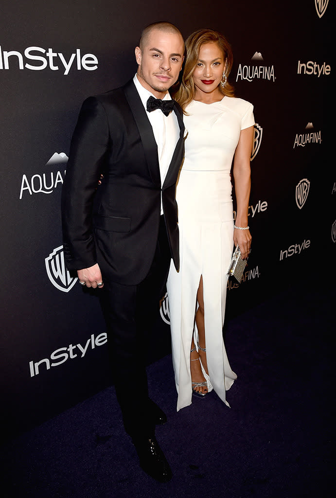 Casper Smart and Jennifer Lopez looked comfortable and ready to party, so long as no one brought their red wine anywhere near J.Lo’s white dress. (Photo: Getty Images)