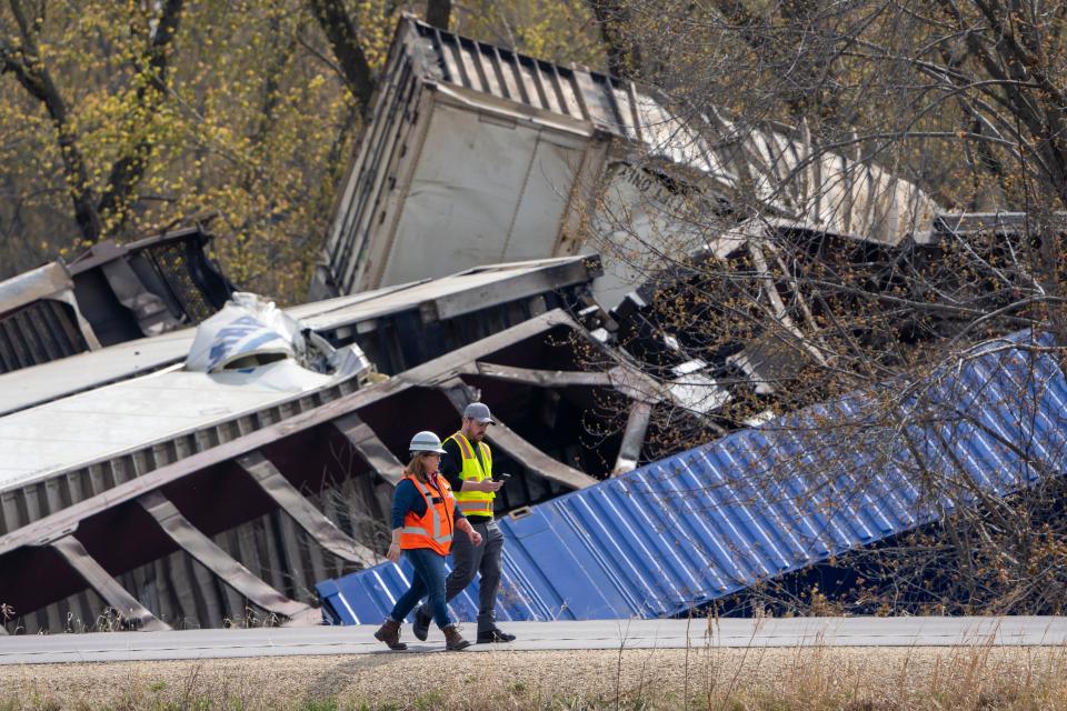 Recovery work is shown at the scene of a train derailment along Hwy 35 Thursday, April 27, 2023 in Crawford County just south of DeSoto, Wis. A freight train derailed along the Mississippi River in southwestern Wisconsin Thursday, possibly injuring one crew member and sending two cars into the water, officials said. (Mark Hoffman/Milwaukee Journal-Sentinel via AP) ORG XMIT: WIMIL102