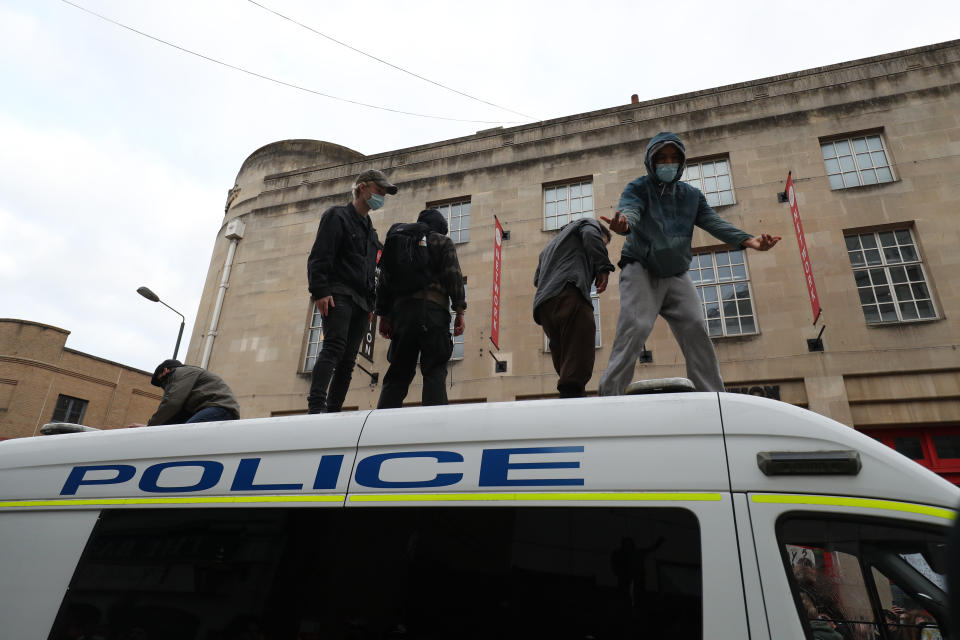 People on top of a police van in front of Bridewell Police Station as they take part in a 'Kill the Bill' protest in Bristol, demonstrating against the Government's controversial Police and Crime Bill. Picture date: Sunday March 21, 2021.