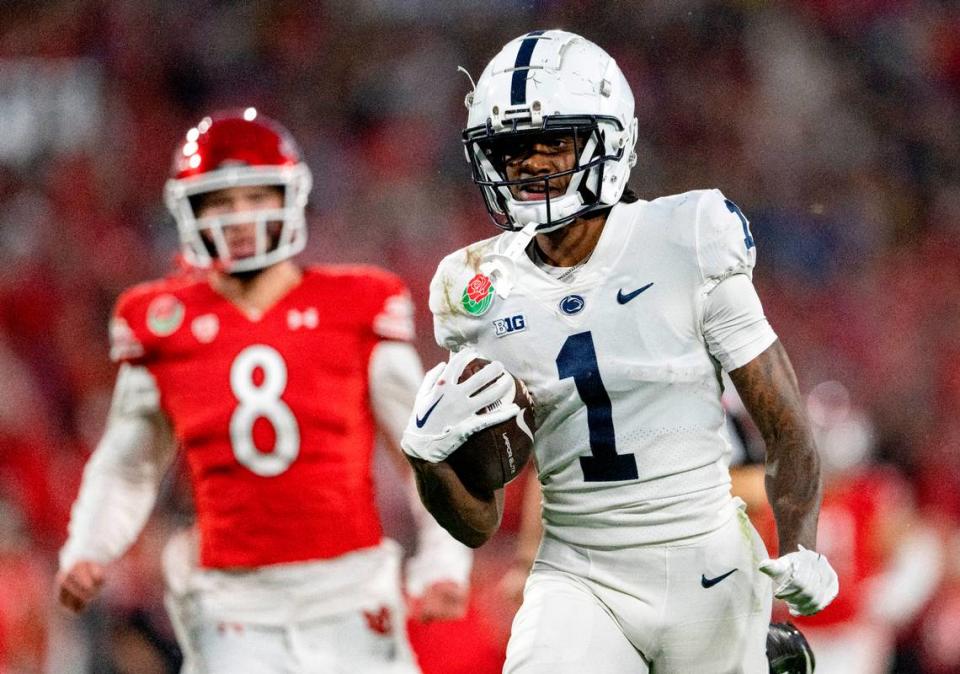 Penn State wide receiver KeAndre Lambert-Smith runs ahead Utah defenders for a touchdown during the Rose Bowl game on Monday, Jan. 2, 2023.