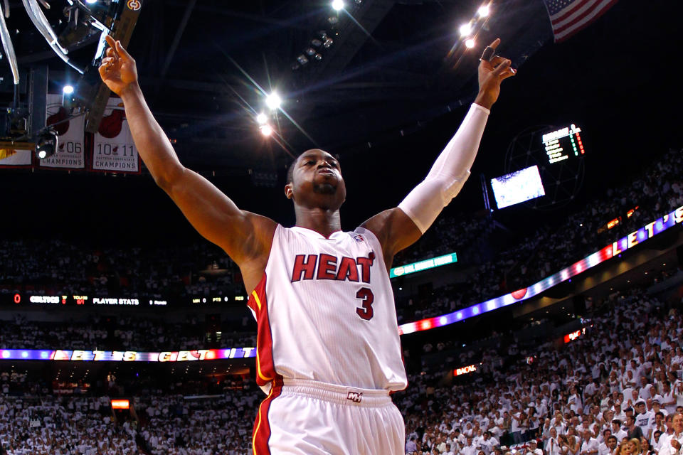 Dwyane Wade acknowledges fans before the Miami Heat take on the Boston Celtics in Game 7 of the 2012 Eastern Conference Finals. Wade has announced that he's coming back to the Heat for a 16th NBA season. (Getty)