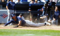 Tampa Bay Rays' Richie Palacios (1) scores against the New York Yankees in the 10th inning inning of a baseball game, Saturday, April 20, 2024 in New York. The Rays won 2-1. (AP Photo/Noah K. Murray)