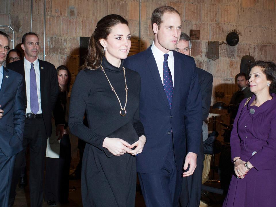 Kate Middleton and Prince William attend an event in 2014.