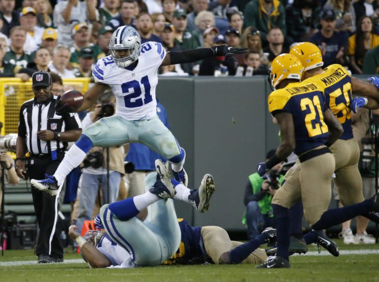 Ezekiel Elliott needs to average 110.6 yards per game for the rest of the year to break Eric Dickerson's single-season record of 1,808 rushing yards. (AP) 