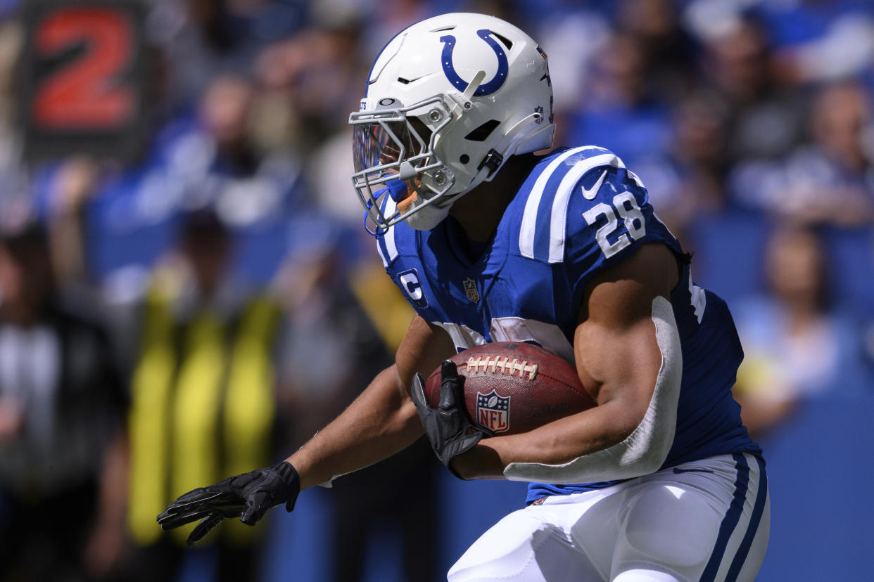 Indianapolis Colts running back Jonathan Taylor (28) runs to the outside during an NFL football game against the Kansas City Chiefs, Sunday, Sept. 25, 2022, in Indianapolis. (AP Photo/Zach Bolinger)