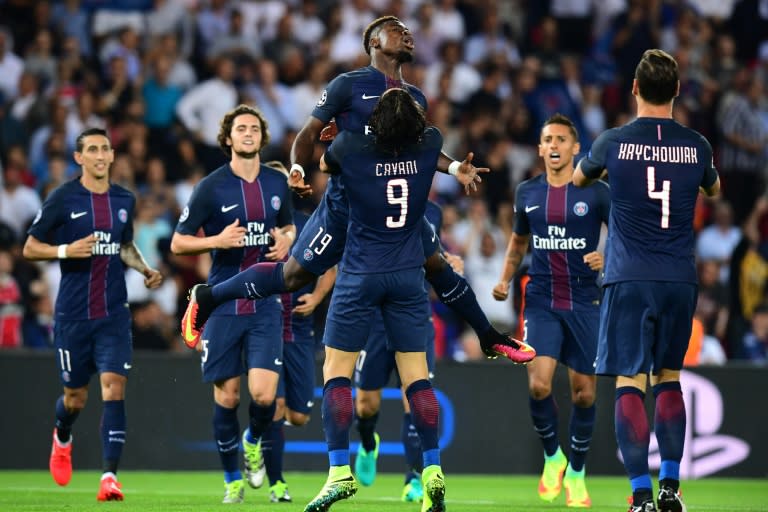 Paris Saint-Germain's forward Edinson Cavani (C-back) celebrates after scoring with his teammate Paris Saint-Germain's Ivorian defender Serge Aurier (C) during the UEFA Champions League Group A football against Arsenal FC, on September 13, 2016