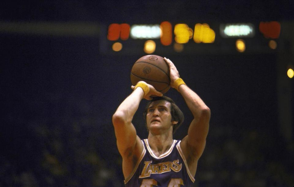 Lakers star Jerry West shoots a free throw during a 1973 game against the Chicago Bulls.