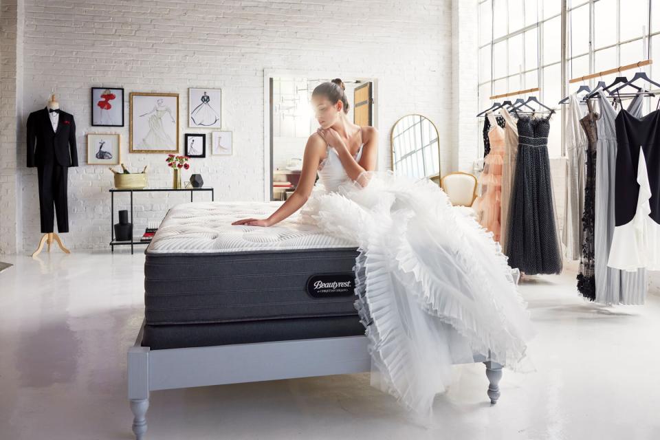 woman in wedding dress on Beautyrest mattress