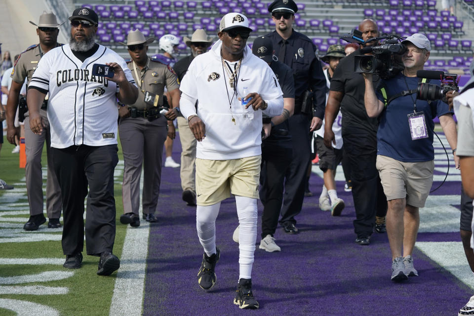 Colorado head coach Deion Sanders walks the field before an NCAA college football game against TCU Saturday, Sept. 2, 2023, in Fort Worth, Texas. (AP Photo/LM Otero)