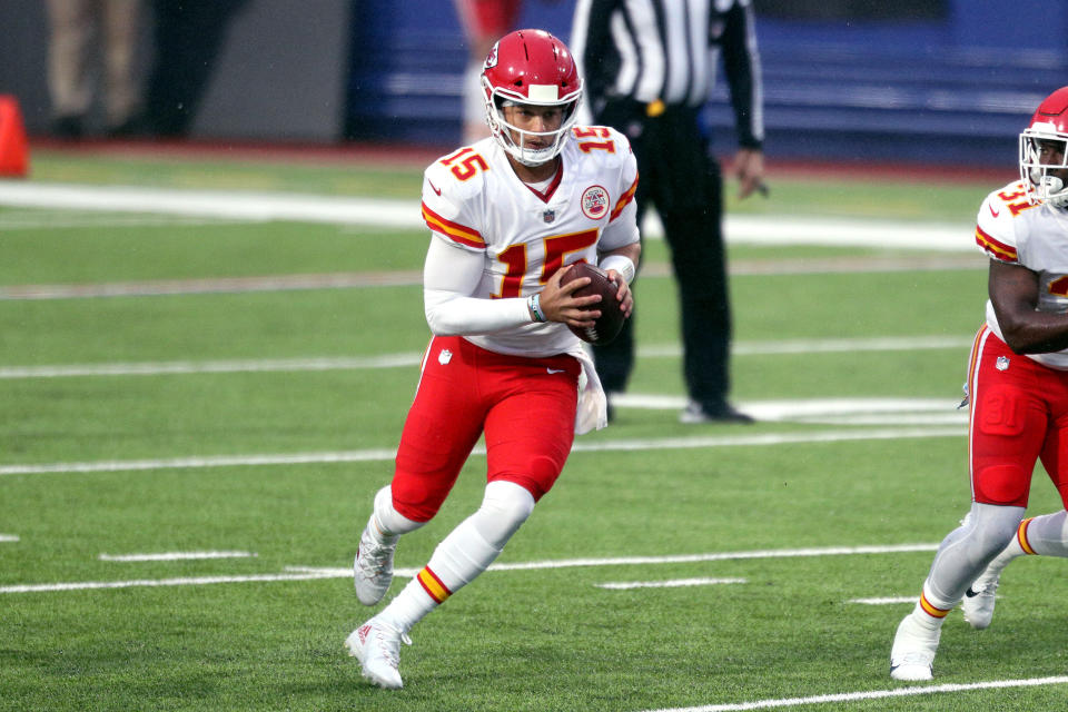 Patrick Mahomes #15 of the Kansas City Chiefs scrambles with the ball against the Buffalo Bills during the first half at Bills Stadium on October 19, 2020 in Orchard Park, New York. (Photo by Bryan M. Bennett/Getty Images)