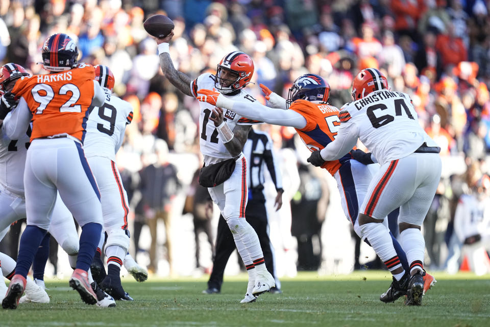 Cleveland Browns quarterback Dorian Thompson-Robinson (17) throws under pressure from Denver Broncos linebacker Barron Browning as Browns offensive tackle Geron Christian (64) defends during the first half of an NFL football game on Sunday, Nov. 26, 2023, in Denver. (AP Photo/Jack Dempsey)