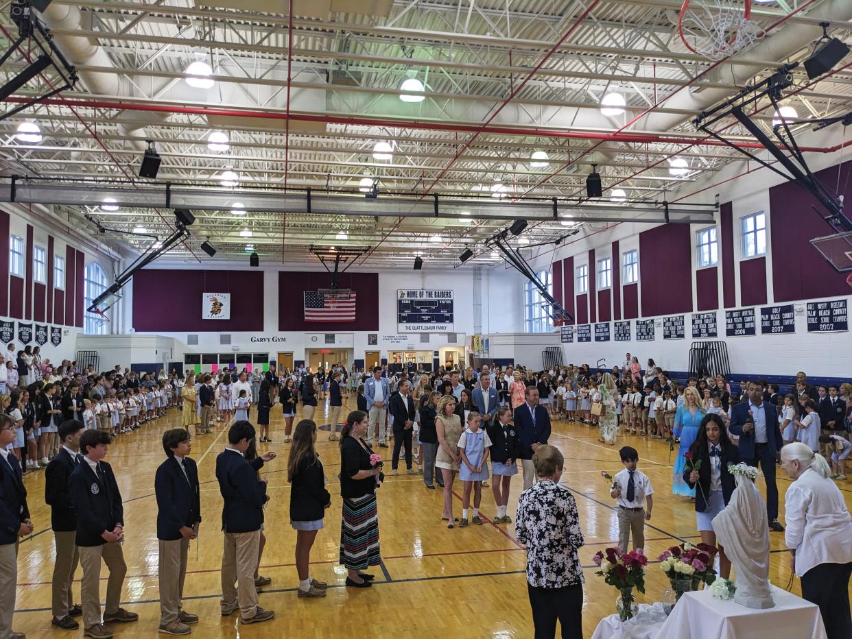 Rosarian Academy students take part May 1 in the traditional May crowning ceremony.