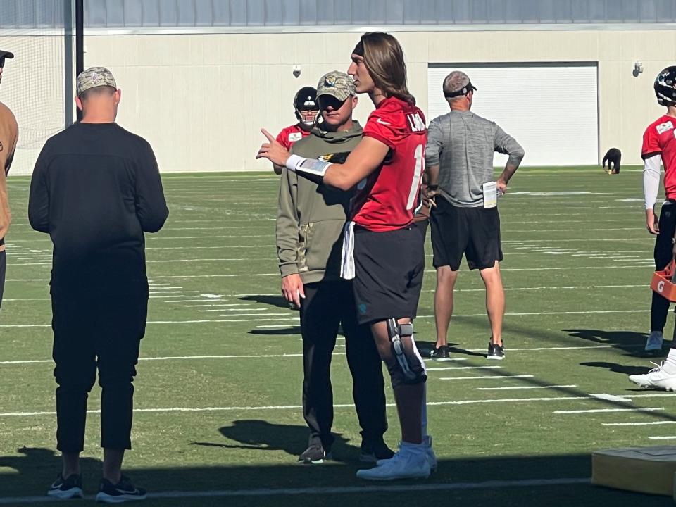 Trevor Lawrence works with Jaguars trainers in 2023 during his recovery from an ankle injury.