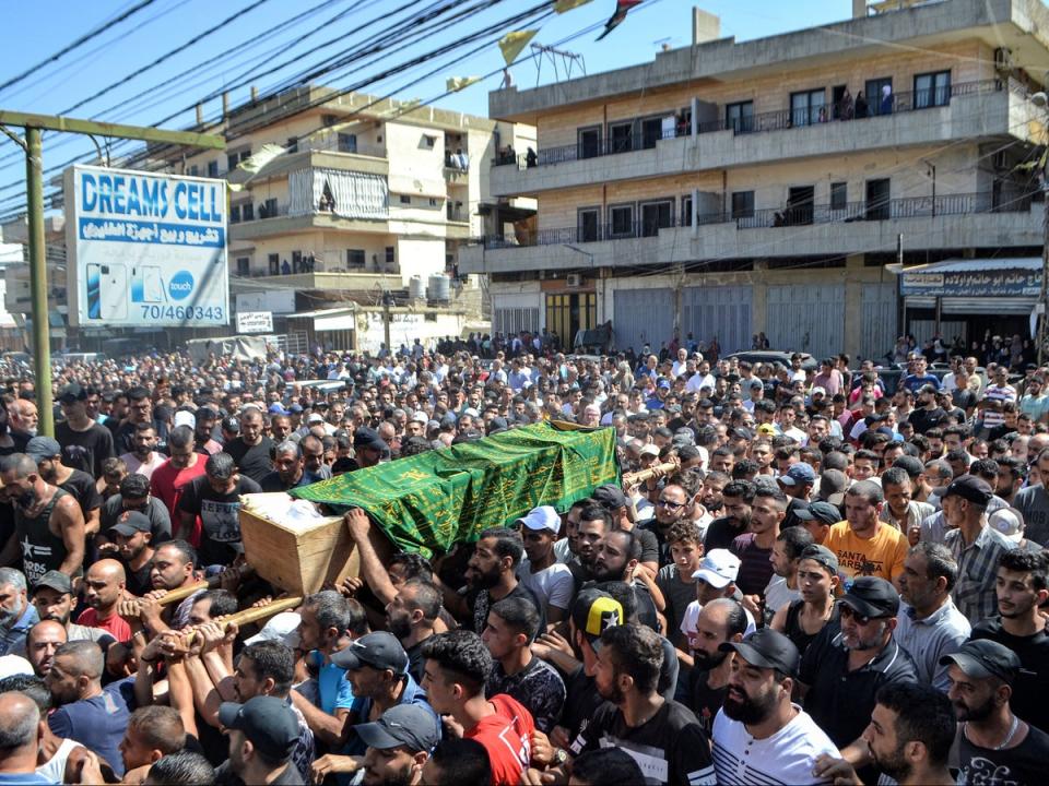 Mourners march with the body of one of the victims who drowned in the shipwreck off the Syrian coast (FATHI AL-MASRI/AFP via Getty Images)