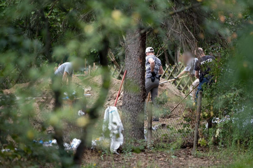 28 July 2020, Lower Saxony, Seelze: Police officers are searching an allotment garden plot. In the case of the missing Maddie McCann, police have begun searching an allotment garden plot in Hanover. Photo: Peter Steffen/dpa - ATTENTION: People were pixelated for legal reasons (Photo by Peter Steffen/picture alliance via Getty Images)