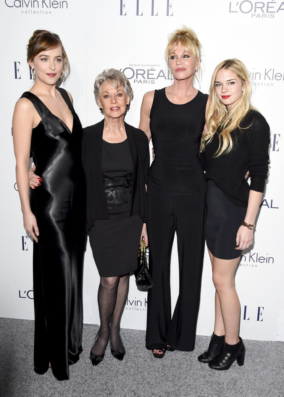 Dakota Johnson in a black Calvin Klein dress with her grandmother, Tippi Hedren, mother, Melanie Griffith, and sister Stella Banderas at the ELLE Women in Hollywood Awards. 