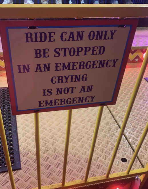 Sign on a ride reads: "Ride can only be stopped in an emergency. Crying is not an emergency."