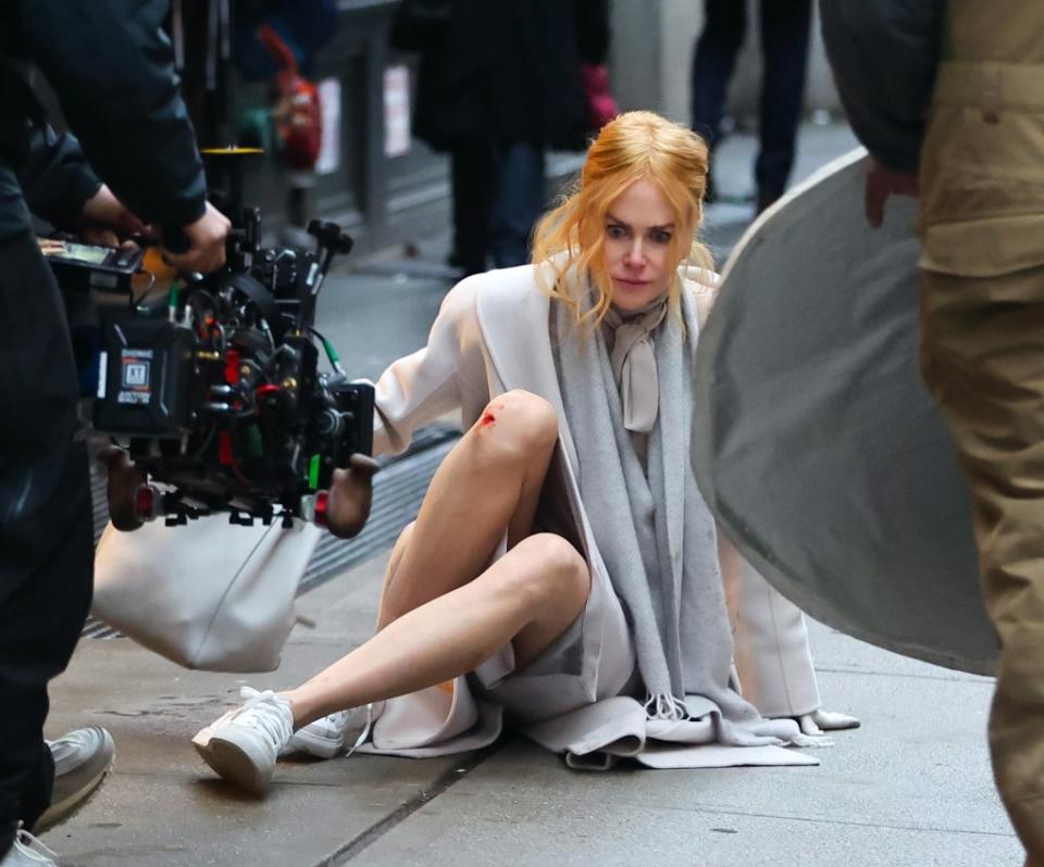 In photos obtained by The Post, Kidman, 56, can be seen looking wild-eyed as she sits on her butt while wearing a cream-colored coat and a light grey scarf. GC Images