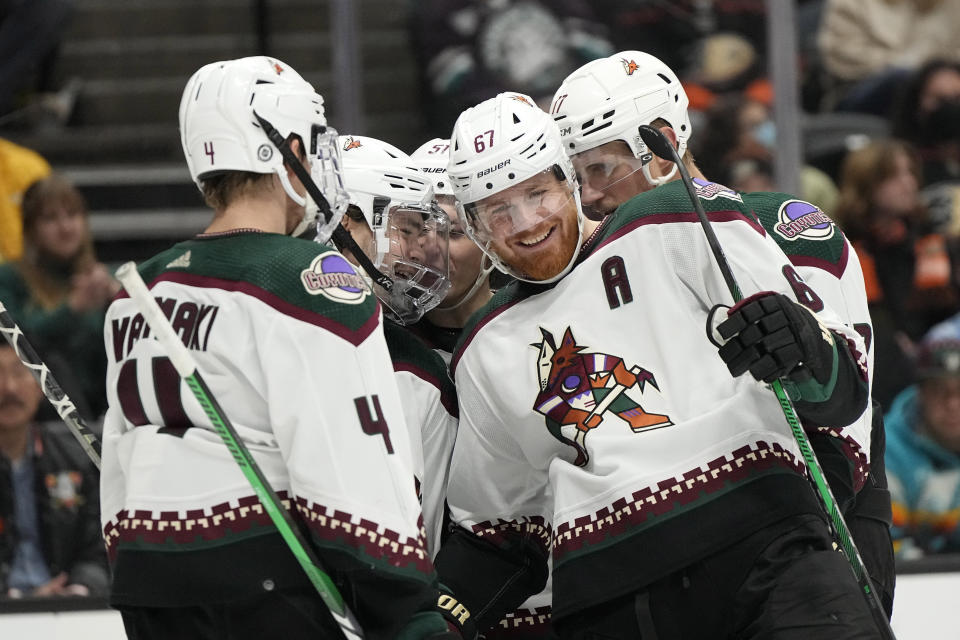 Arizona Coyotes left wing Lawson Crouse (67) celebrates his goal with teammates during the second period of an NHL hockey game against the Anaheim Ducks Friday, Dec. 29, 2023, in Anaheim, Calif. (AP Photo/Mark J. Terrill)